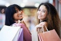 Friends portrait, shopping and women walking in a mall together for retail therapy, sale and customer discount. Paper Royalty Free Stock Photo