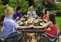 Friends praying together before lunch Royalty Free Stock Photo