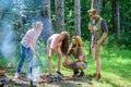 Friends prepare roasted sausages snacks nature background. Camping traditional meal prepared on fire with smoky aroma