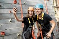 Man and woman taking selfie photo near the climbing wall