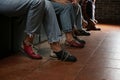 Friends putting shoes on at n bowling club, closeup