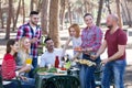 Friends relaxing at grill party Royalty Free Stock Photo