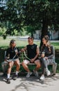 Friends relaxing outdoors with beverages after a workout session Royalty Free Stock Photo