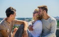 Friends relaxing on roof. Carefree friends. True friendship. Being sincere with closest people. Men and woman talking Royalty Free Stock Photo