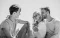 Friends relaxing on roof. Men and woman talking sky background. Spending time with friends. Summer vacation. Discussing Royalty Free Stock Photo