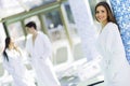 Friends relaxing in a spa next to a swimming pool Royalty Free Stock Photo