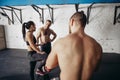 People relaxing and taking a break after working out at a cross-training gym Royalty Free Stock Photo