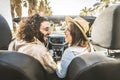 Happy couple driving convertible car enjoying summer vacation Royalty Free Stock Photo