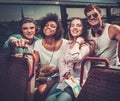 Friends riding on a sightseeing bus Royalty Free Stock Photo