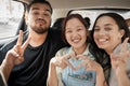 Friends, road trip and hand gesture with a man and woman group making peace and heart shape sign in a car. Diversity Royalty Free Stock Photo