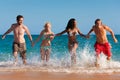 Friends running on beach vacation Royalty Free Stock Photo