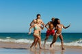 Friends running on beach vacation Royalty Free Stock Photo