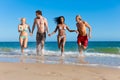 Friends running on beach vacation Royalty Free Stock Photo