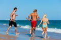 Friends running on beach vacation Royalty Free Stock Photo