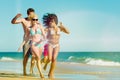 Friends running on beach vacation Royalty Free Stock Photo