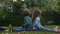 Friends selfie. Excited young children playing lying on grass meadow. Little brother and sister monkeying on camera and