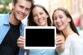 Friends showing a blank tablet screen Royalty Free Stock Photo