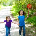 Friends and sister girls running in the forest track happy Royalty Free Stock Photo