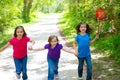 Friends and sister girls running in the forest track happy Royalty Free Stock Photo