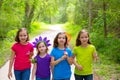 Friends and sister girls walking outdoor in forest track Royalty Free Stock Photo