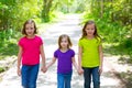 Friends and sister girls walking outdoor in forest track Royalty Free Stock Photo