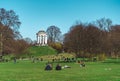 Friends sitting in the English Garden (Englischer Garten) in Munich on a beautiful sunny day in wint