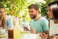 Friends sitting in outdoor restaurant Royalty Free Stock Photo
