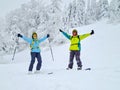 friends skier and snowboarder powder day