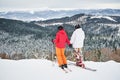 Friends skiers having fun at ski resort in the mountains in winter, skiing and snowboarding Royalty Free Stock Photo