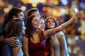 Friends with smartphone taking selfie in club Royalty Free Stock Photo