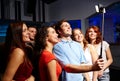 Friends with smartphone taking selfie in club Royalty Free Stock Photo