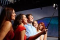 Friends with smartphone taking selfie in club Royalty Free Stock Photo