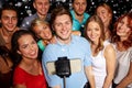 Friends with smartphone taking selfie in club Royalty Free Stock Photo