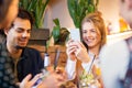 Friends with smartphones eating at restaurant Royalty Free Stock Photo