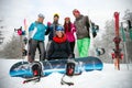 Friends snowboarders and skiers have fun on the slope Royalty Free Stock Photo
