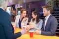 friends socializing in cinema lobby lounge