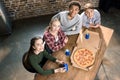 Friends spending time together with pizza and soda drinks, eating pizza at home concept Royalty Free Stock Photo