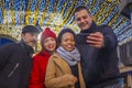 Friends standing outdoor  and taking selfie photos Royalty Free Stock Photo