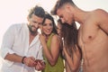 Friends standing together and having fun on the beach Royalty Free Stock Photo