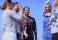 Friends students giving each other a high five. Royalty Free Stock Photo