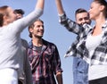 Friends students giving each other a high five. Royalty Free Stock Photo