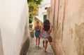 Friends, summer and travel on city alley steps in Brazil for holiday, walk and adventure. Youth, freedom and girl