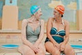 Friends, swimming and senior women on retirement vacation while happy, talking and having fun during funny conversation Royalty Free Stock Photo