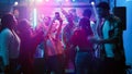 Friends taking pictures at disco party Royalty Free Stock Photo