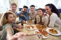 Friends Taking Selfie On Phone Having Fun At Home In Kitchen Eating Homemade Pizzas Royalty Free Stock Photo