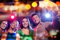 Friends taking selfie by smartphone in night club Royalty Free Stock Photo