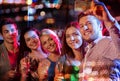 Friends taking selfie by smartphone in night club Royalty Free Stock Photo