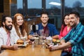 Friends taking selfie by smartphone at restaurant Royalty Free Stock Photo