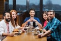 Friends taking selfie by smartphone at restaurant Royalty Free Stock Photo