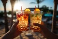 Friends toasting with tropical drinks on a sunny beach - stock photography concepts Royalty Free Stock Photo